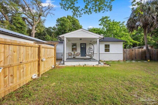 202 Henry St, Pensacola, FL 32507 - rear view of house featuring a porch and brick siding