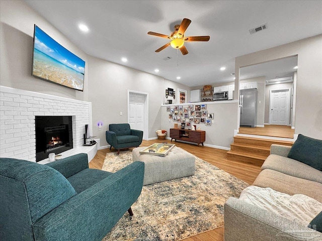 202 Henry St, Pensacola, FL 32507 - living room with a ceiling fan, light wood-type flooring, recessed lighting, a fireplace, and baseboards