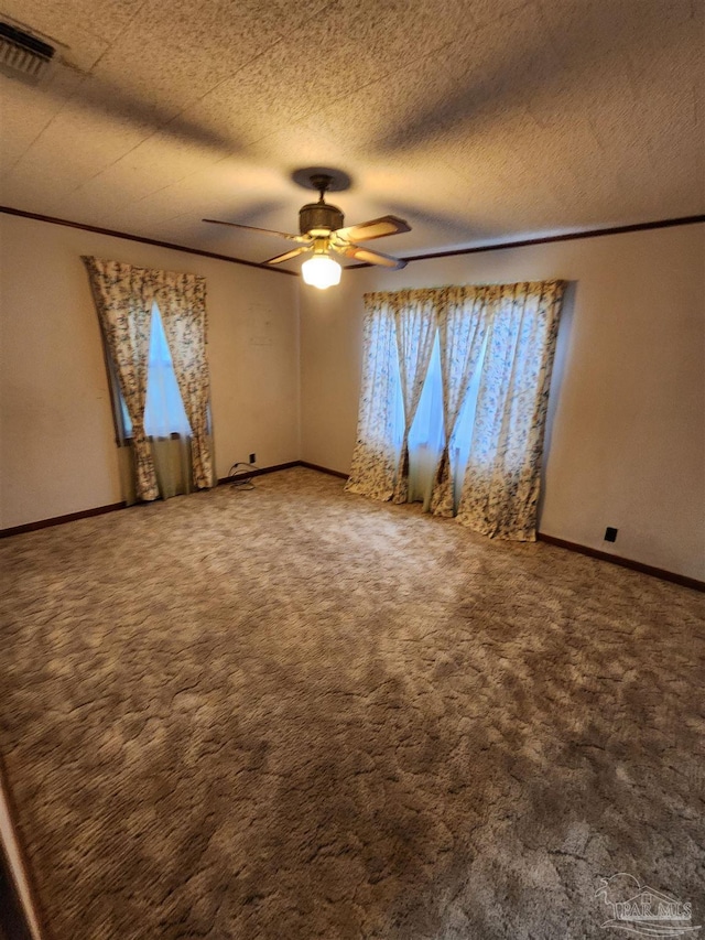 unfurnished room with ceiling fan, carpet flooring, and a healthy amount of sunlight