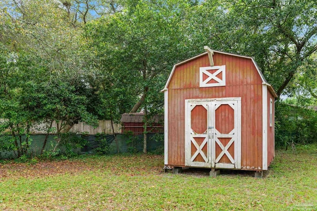 view of shed with fence