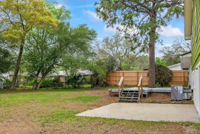 view of yard featuring a patio and fence