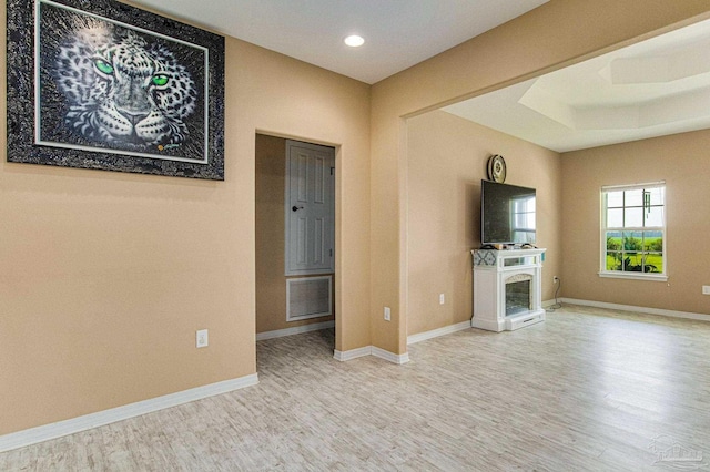 unfurnished living room featuring hardwood / wood-style floors