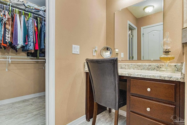 bathroom featuring hardwood / wood-style flooring and vanity