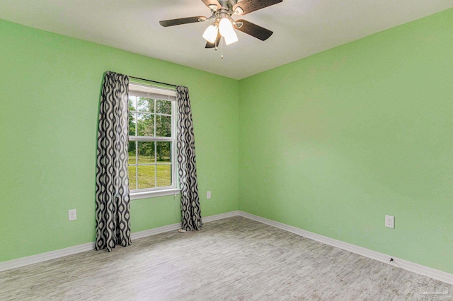 spare room with ceiling fan and light hardwood / wood-style flooring