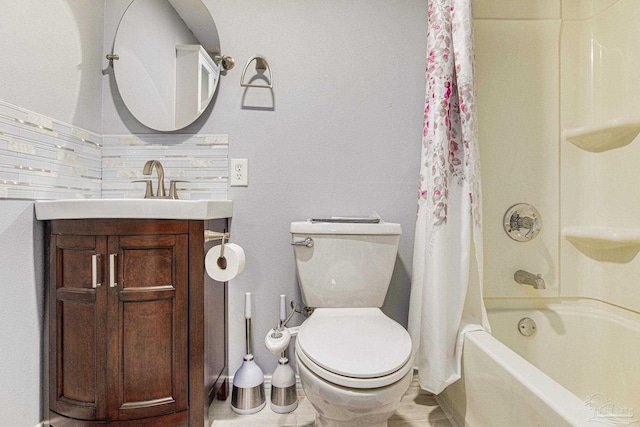 full bathroom featuring shower / tub combo, vanity, and toilet