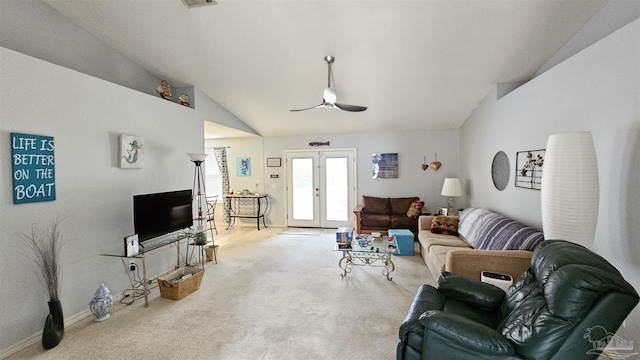 carpeted living room featuring lofted ceiling and french doors