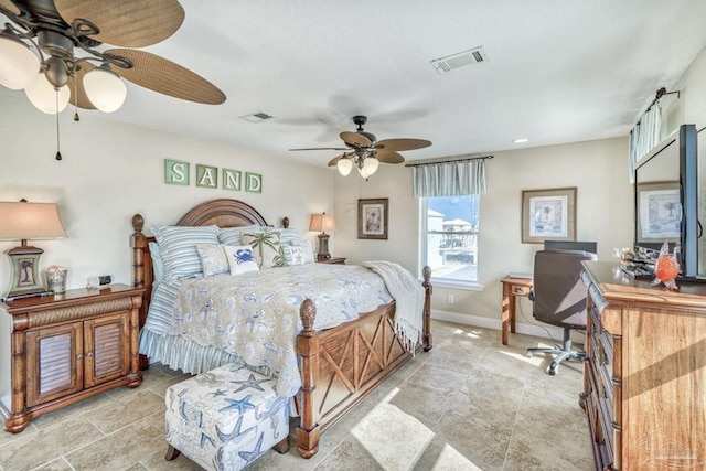 bedroom with visible vents and baseboards