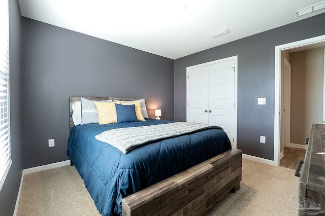 bedroom with carpet floors and a closet