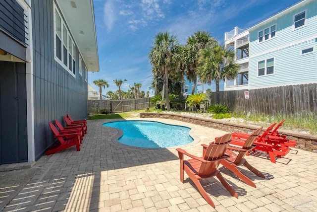 view of swimming pool with a patio area