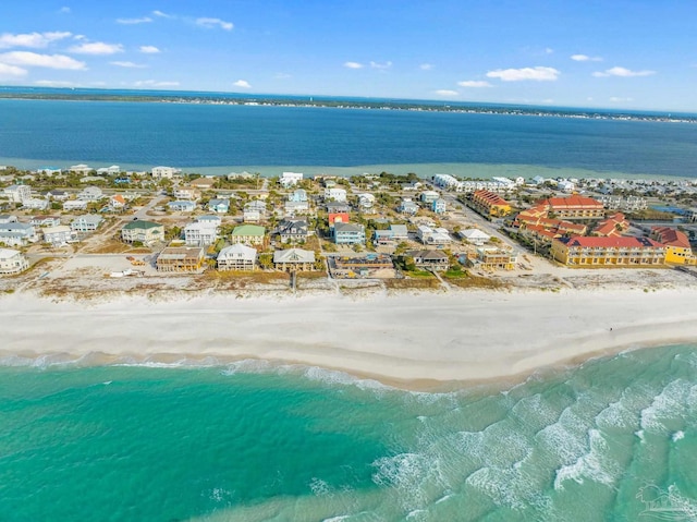 bird's eye view with a view of the beach and a water view