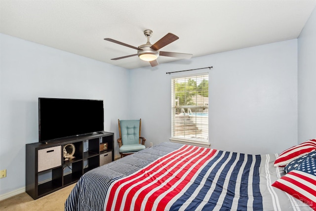 carpeted bedroom featuring ceiling fan