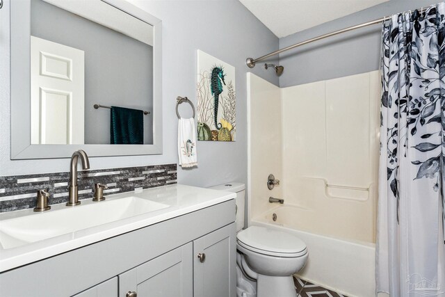 full bathroom with shower / bath combination with curtain, vanity, toilet, and decorative backsplash