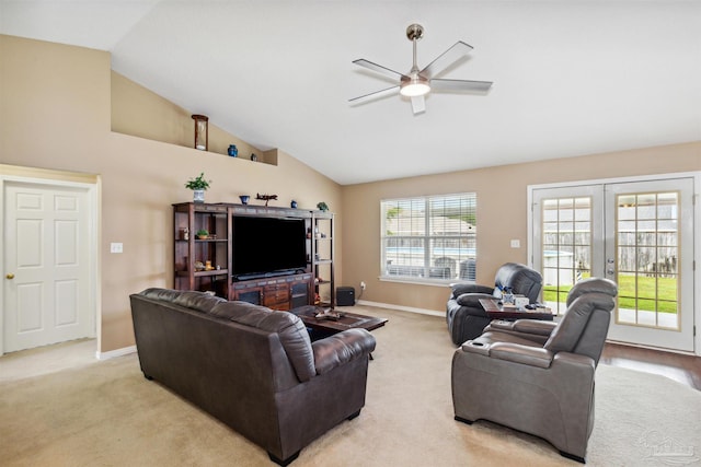 living room featuring ceiling fan, light carpet, high vaulted ceiling, and french doors