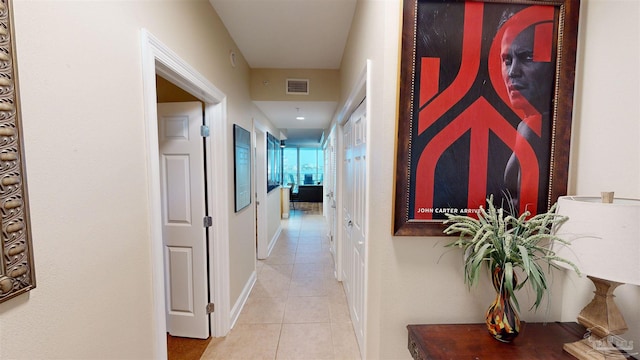 hallway with light tile patterned floors