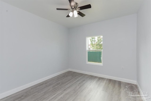 empty room featuring ceiling fan and light wood-type flooring