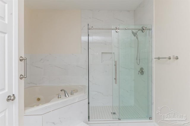 bathroom with separate shower and tub