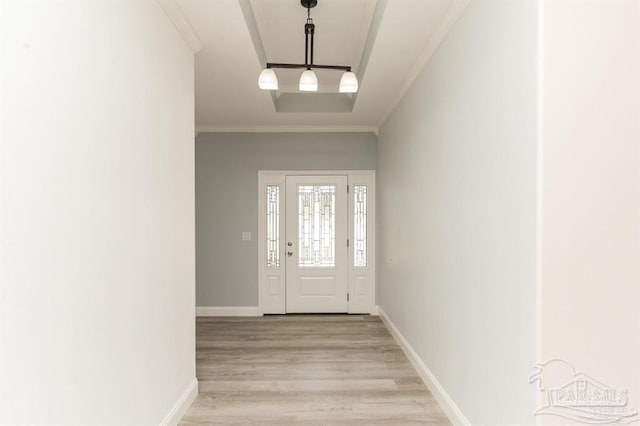 entryway featuring light hardwood / wood-style flooring and ornamental molding