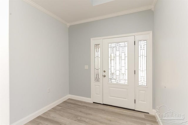 foyer with light hardwood / wood-style floors and ornamental molding