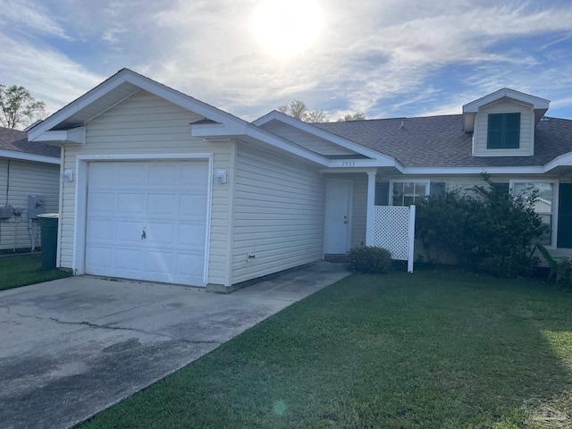 single story home featuring a garage and a front lawn