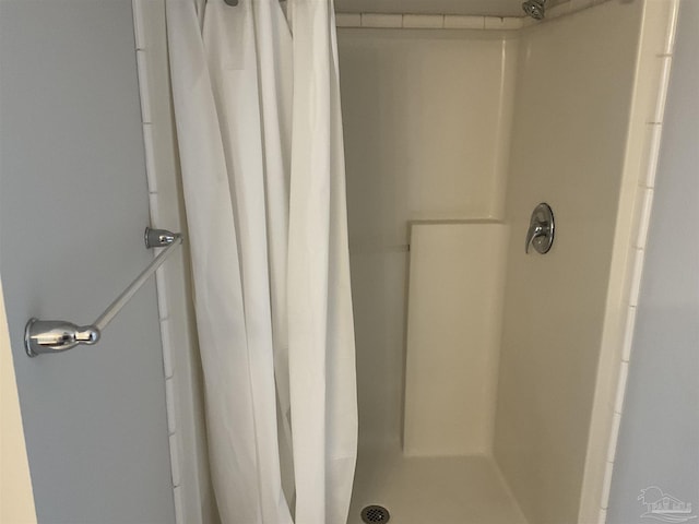 bathroom with a shower with shower curtain