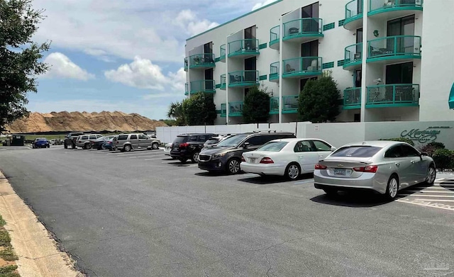 view of parking with a mountain view