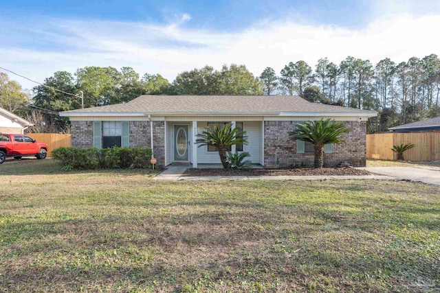 ranch-style home featuring a front yard