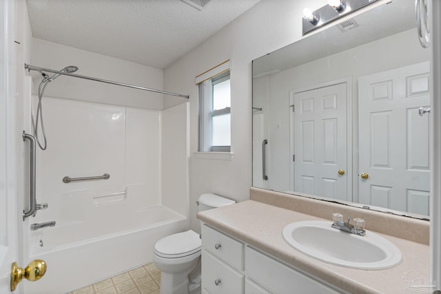 bathroom with toilet, bathtub / shower combination, tile patterned floors, a textured ceiling, and vanity