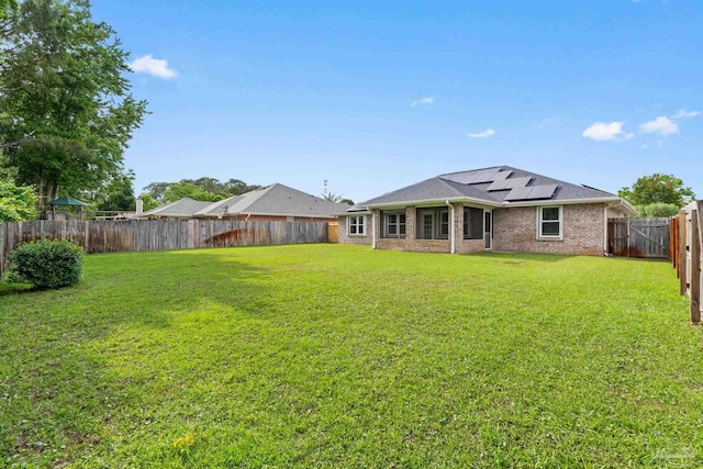 view of yard with a fenced backyard