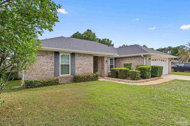 ranch-style house featuring a front yard, brick siding, driveway, and a garage