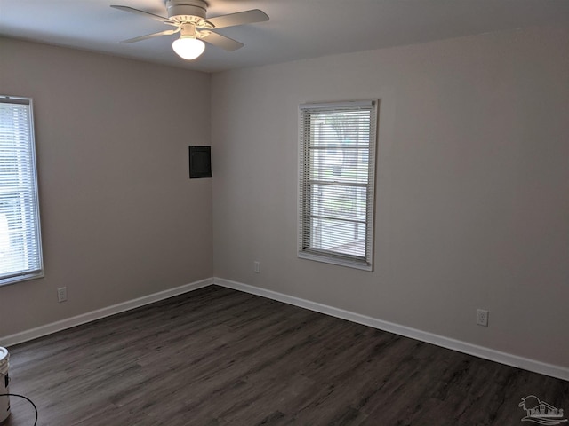 unfurnished room with hardwood / wood-style floors, a wealth of natural light, and ceiling fan