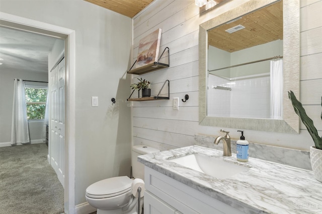 bathroom featuring wood walls, vanity, wood ceiling, walk in shower, and toilet