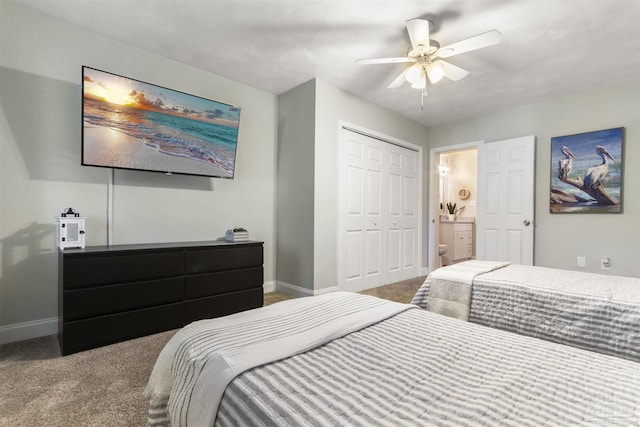 carpeted bedroom with connected bathroom, a closet, and ceiling fan