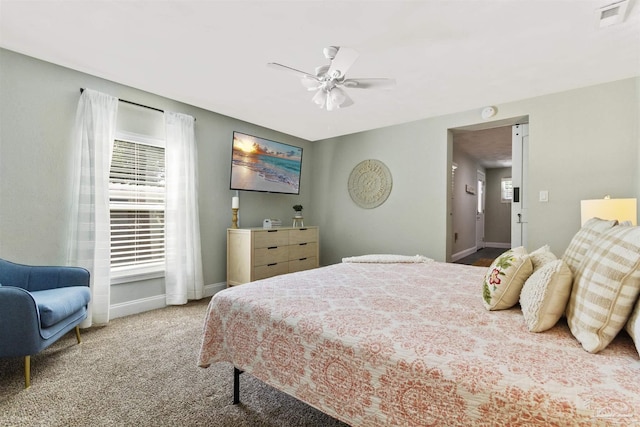 bedroom featuring multiple windows, carpet floors, and ceiling fan