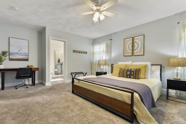 bedroom with light colored carpet, ceiling fan, and ensuite bath