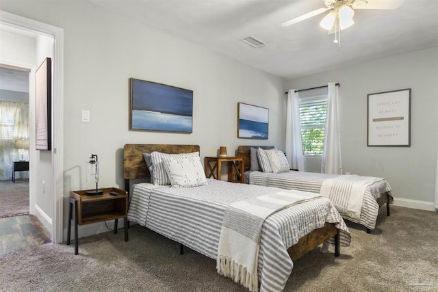 bedroom featuring dark colored carpet and ceiling fan