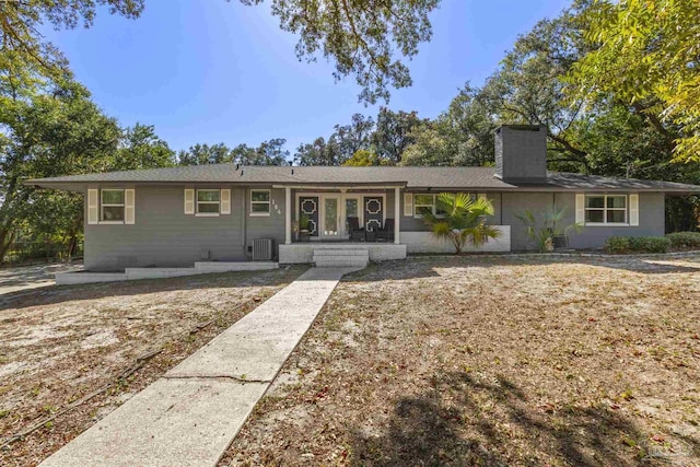 ranch-style house featuring central air condition unit