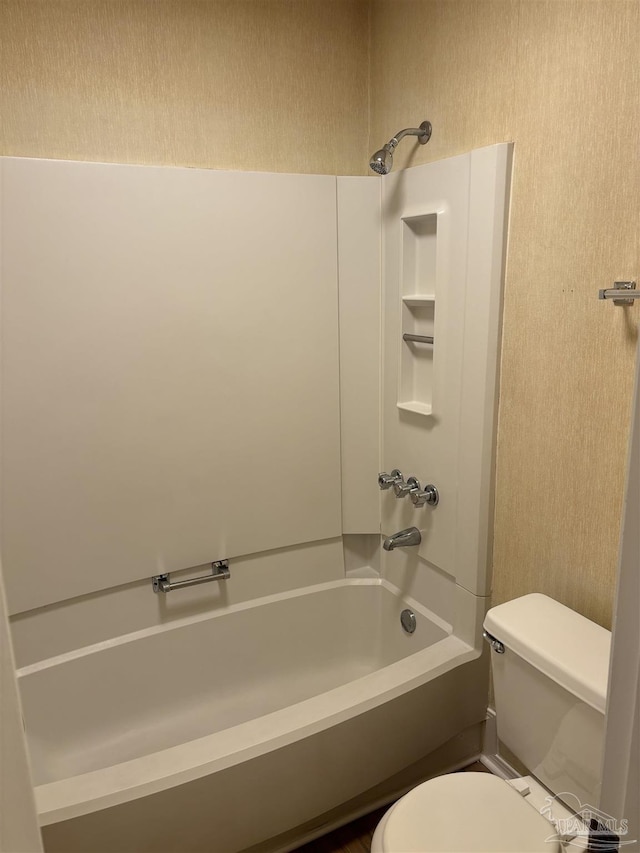 bathroom with toilet and shower / washtub combination