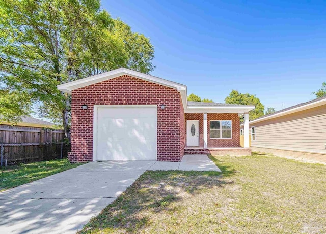 view of front of property featuring a garage and a front yard