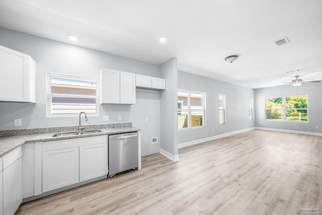 kitchen with light hardwood / wood-style floors, dishwasher, sink, and white cabinets