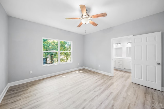 unfurnished bedroom with ceiling fan, light hardwood / wood-style floors, and ensuite bath