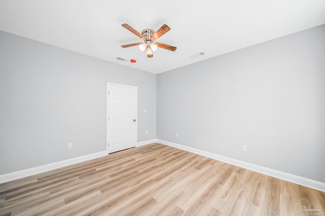 unfurnished room with ceiling fan and light hardwood / wood-style floors