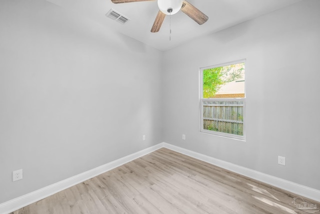 empty room featuring ceiling fan and light wood-type flooring