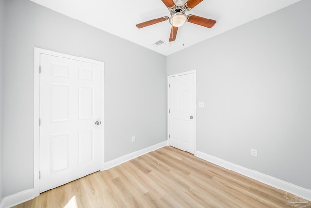 unfurnished bedroom with light hardwood / wood-style floors and ceiling fan