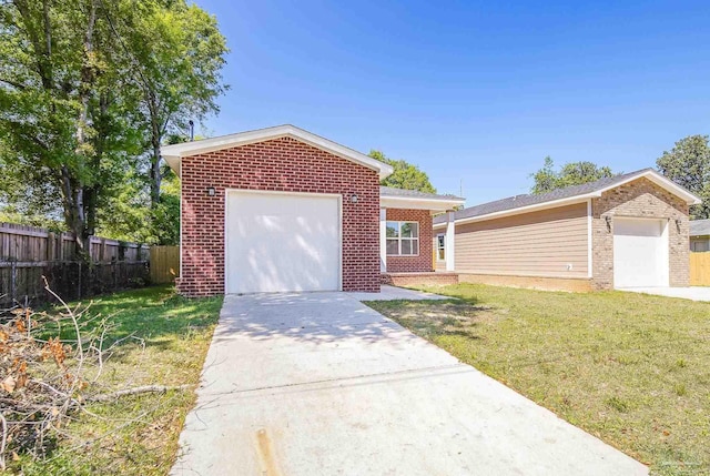 view of front facade with a garage and a front yard