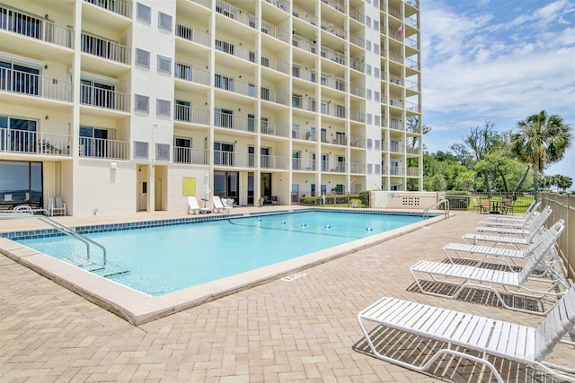 view of swimming pool with a patio