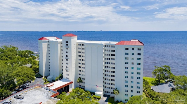 birds eye view of property with a water view