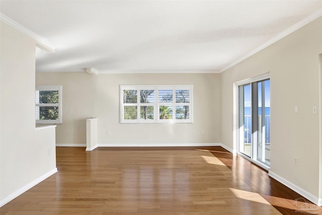 unfurnished room with crown molding and hardwood / wood-style floors