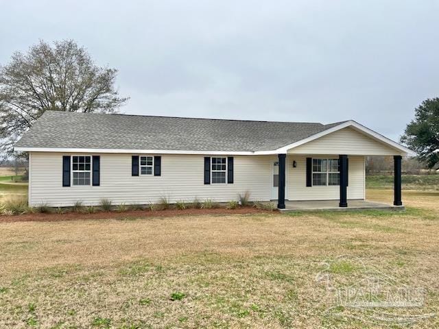 single story home with a shingled roof and a front lawn