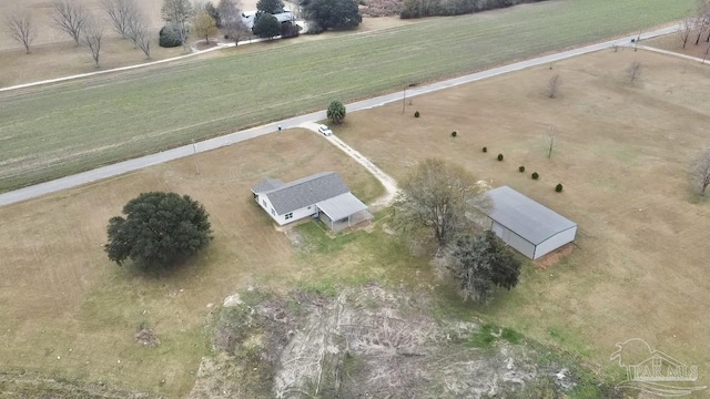 birds eye view of property with a rural view