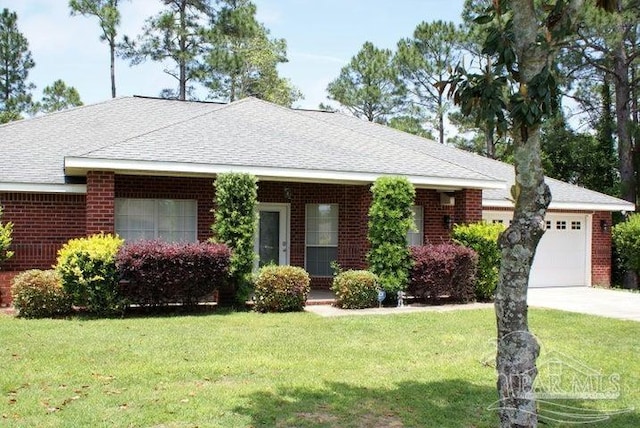 ranch-style home with a front lawn and a garage